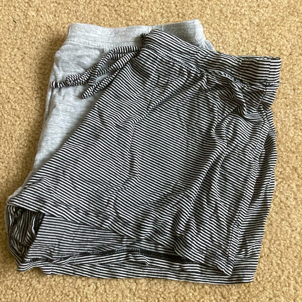 Black and white striped, and grey womans pajama shorts